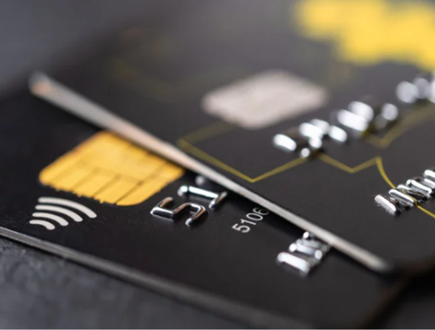 A close up of two black credit cards